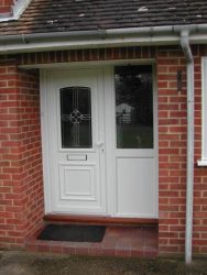 White uPVC entrance door with custom glass design
