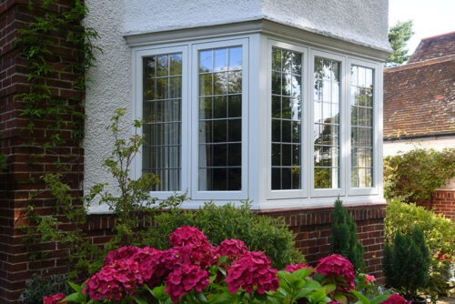 Flush-casement-windows-with-leaded-light-detailing-finished-in-White