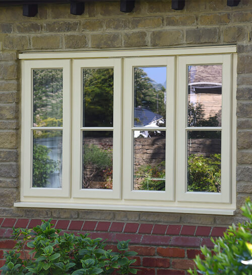 New timber lipped casement windows finished in Dorset Cream