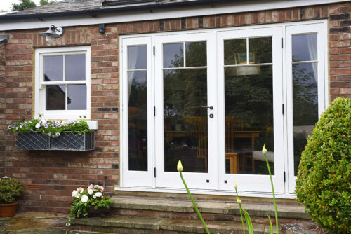 Timber-French-doors-with-glazing-bars-in-T-bar-formation
