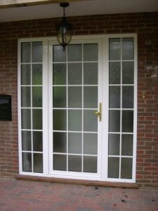 White aluminium entrance door with frosted glass