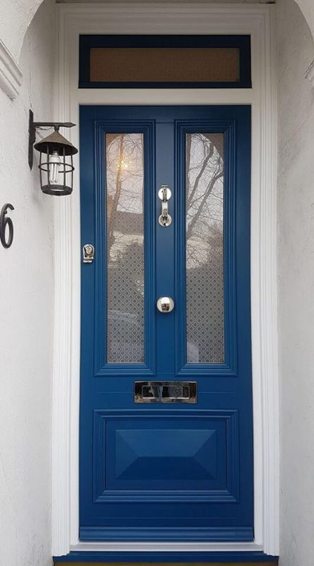 Blue timber entrance door with silver hardware