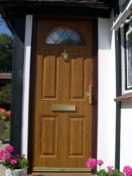 Dual oak effect composite entrance door