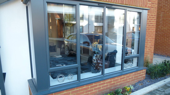 Grey slimline aluminium bay window