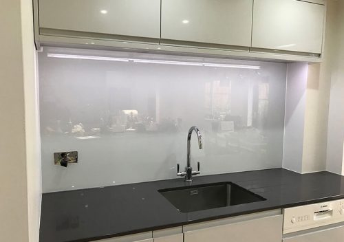 Light grey sink glass splash back