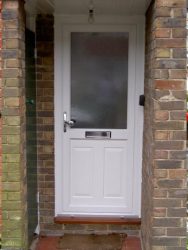 White uPVC entrance door with silver door